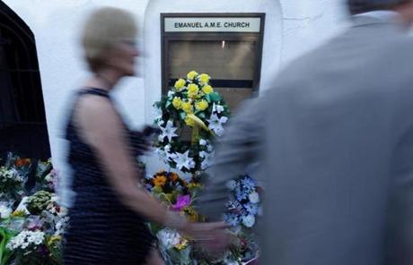 Mourners passed by a make-shift memorial Thursday on the sidewalk of in front of the Emanuel AME Church.
